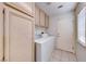 Laundry room with washer, dryer and storage cabinets at 4416 Inez Dr, Las Vegas, NV 89130