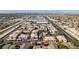 Aerial view showcasing apartment complex with pool, parking and distant city views at 4555 E Sahara Ave # 255, Las Vegas, NV 89104