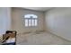 Empty bedroom with large window and neutral carpeting at 4555 E Sahara Ave # 255, Las Vegas, NV 89104