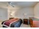 Simple bedroom with double bed and wood dresser at 4555 E Sahara Ave # 255, Las Vegas, NV 89104