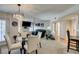 Elegant dining room features a glass table and white chairs at 4555 E Sahara Ave # 255, Las Vegas, NV 89104