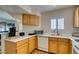 Kitchen with white countertops and wood cabinets at 4555 E Sahara Ave # 255, Las Vegas, NV 89104