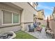 Private backyard with patio furniture and grill at 4655 Fuchsia Nights Ave # 103, North Las Vegas, NV 89084