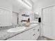 Double vanity bathroom with granite countertops and modern fixtures at 4655 Fuchsia Nights Ave # 103, North Las Vegas, NV 89084