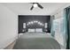 Bright bedroom with a king-size bed and modern ceiling fan at 4655 Fuchsia Nights Ave # 103, North Las Vegas, NV 89084