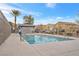 Community swimming pool with surrounding fence at 4655 Fuchsia Nights Ave # 103, North Las Vegas, NV 89084