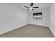 Bright bedroom with ceiling fan and neutral carpeting at 5423 Arturo Ct, Las Vegas, NV 89120