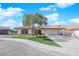 Single story home with a two-car garage and landscaped front yard at 5423 Arturo Ct, Las Vegas, NV 89120