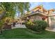 Landscaped backyard oasis with a large patio and lush greenery at 609 China Doll Pl, Henderson, NV 89012