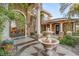 Elegant entryway with ornate doors and a central fountain at 609 China Doll Pl, Henderson, NV 89012