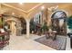 Grand entryway with stone columns and staircase at 609 China Doll Pl, Henderson, NV 89012