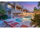 Resort-style pool with waterfall feature and lounge chairs at 609 China Doll Pl, Henderson, NV 89012