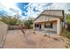 Covered patio and desert landscaping in backyard at 6504 Birdcall St, North Las Vegas, NV 89084