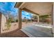 Covered patio and desert landscaping in backyard at 6504 Birdcall St, North Las Vegas, NV 89084