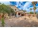 Two-story home with covered patio and desert landscape at 6504 Birdcall St, North Las Vegas, NV 89084