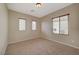 Well-lit bedroom with carpet and window coverings at 6504 Birdcall St, North Las Vegas, NV 89084