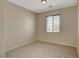 Simple bedroom with large window and carpet at 6504 Birdcall St, North Las Vegas, NV 89084