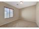 Bright bedroom featuring a window and neutral walls at 6504 Birdcall St, North Las Vegas, NV 89084