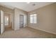 Well-lit bedroom with closet and access to hallway at 6504 Birdcall St, North Las Vegas, NV 89084