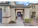 Front entry with covered walkway and purple door at 6504 Birdcall St, North Las Vegas, NV 89084