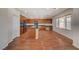 Kitchen with island, wood cabinets, and granite countertops at 6504 Birdcall St, North Las Vegas, NV 89084