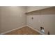 Laundry room with built-in shelving and tile floor at 6504 Birdcall St, North Las Vegas, NV 89084