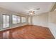 Bright and airy living room with hardwood floors and ceiling fan at 6504 Birdcall St, North Las Vegas, NV 89084