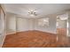 Living room with hardwood floors and ceiling fan at 6504 Birdcall St, North Las Vegas, NV 89084