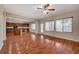 Open concept living room with hardwood floors and kitchen views at 6504 Birdcall St, North Las Vegas, NV 89084