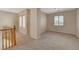 Spacious loft area with wood railing and window at 6504 Birdcall St, North Las Vegas, NV 89084