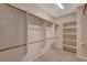 Large walk-in closet with shelves and hanging rods at 6504 Birdcall St, North Las Vegas, NV 89084