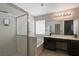 Modern bathroom with dual vanity, soaking tub, and walk-in shower at 6536 Elk Creek Ln, Las Vegas, NV 89156