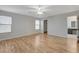 Bright bedroom featuring wood-look floors and an ensuite bathroom at 6536 Elk Creek Ln, Las Vegas, NV 89156