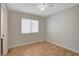 Spacious bedroom with light wood flooring and ceiling fan at 6536 Elk Creek Ln, Las Vegas, NV 89156