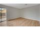 Bright bedroom with wood flooring and sliding door to patio at 6536 Elk Creek Ln, Las Vegas, NV 89156