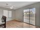 Bright dining area with wood floors and sliding glass door leading to backyard at 6536 Elk Creek Ln, Las Vegas, NV 89156