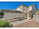 Two-story house with a walkway leading to the entrance at 6536 Elk Creek Ln, Las Vegas, NV 89156