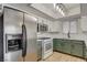 Modern kitchen with stainless steel appliances and white cabinets at 6536 Elk Creek Ln, Las Vegas, NV 89156