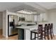 Modern kitchen with stainless steel appliances and an island at 6536 Elk Creek Ln, Las Vegas, NV 89156