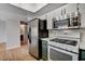 Kitchen area with stainless steel refrigerator and white countertop at 6536 Elk Creek Ln, Las Vegas, NV 89156