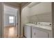 Laundry room with washer, dryer, and shelving at 6536 Elk Creek Ln, Las Vegas, NV 89156