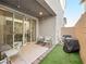 Private backyard with patio, artificial turf, and grill at 686 Last Dance Pl, Henderson, NV 89011