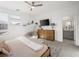 Main bedroom with a dresser, TV and a view of the bathroom at 686 Last Dance Pl, Henderson, NV 89011