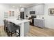 Modern kitchen with gray cabinets, quartz countertops, and island at 686 Last Dance Pl, Henderson, NV 89011