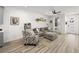 Living room with gray sectional sofa and ceiling fan at 686 Last Dance Pl, Henderson, NV 89011