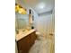 Cozy bathroom with marble floors, a vanity with a mirror, and a shower/tub combo at 7329 Restful Springs Ct, Las Vegas, NV 89128