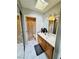 Bathroom featuring a vanity with sink, a large mirror, and a nearby shower/tub combo at 7329 Restful Springs Ct, Las Vegas, NV 89128