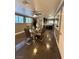 Open concept dining area features tile flooring, a ceiling fan, and seamlessly flows into the kitchen at 7329 Restful Springs Ct, Las Vegas, NV 89128