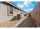 AC unit and walkway in a gravel backyard at 788 Flowing Meadow Dr, Henderson, NV 89014