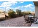 Relaxing backyard patio with seating area and lush landscaping at 788 Flowing Meadow Dr, Henderson, NV 89014